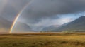 Mountain Landscape With Rolling Hills and Rainbow in Scottish Countryside at Dusk