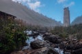 Mountain landscape with ruined svan tower, spring and fog, Svaneti Georgia