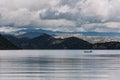 Mountain landscape lake fisherman