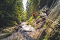 Mountain landscape in Slovakia. Magical forest in natural park .People climbing on steep rock on via ferrata martinske hole