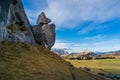 Mountain landscape with snow capped mountains and green hills with rocks Royalty Free Stock Photo