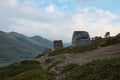 mountain landscape, stone crypts on the mountainside, dolmens, ancient burials, ancestral cemetery