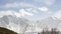 Mountain landscape. Stunning bird's-eye view of a high snow-capped mountain peak