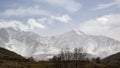 Mountain landscape. Stunning bird's-eye view of a high snow-capped mountain peak