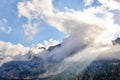 Mountain landscape with a sunbeam breaking through the clouds