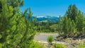 Mountain Landscape On A Sunny Summer Day. Blue Sky, White Clouds, River Splashing, Flowing Over Rocks, Evergreens And Trees Royalty Free Stock Photo