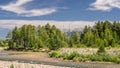 Mountain Landscape On A Sunny Summer Day. Blue Sky, White Clouds, River Splashing, Flowing Over Rocks, Evergreens And Trees Royalty Free Stock Photo