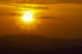 Mountain landscape at sunset. Amazing view from the mountain peak on rocks, low clouds, blue sky and sea in the evening. Colorful Royalty Free Stock Photo