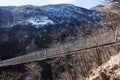 Mountain landscape with suspension bridge Royalty Free Stock Photo