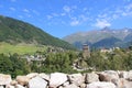 Mountain landscape. Svaneti. Svan tower against the background of a mountain landscape on a clear summer day.