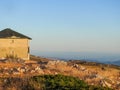 Mountain landscape at Torre, Serra da Estrela, Portugal. Orange sunset at the mountain chain and built structure. Royalty Free Stock Photo