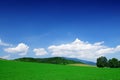 Mountain landscape, view of green rolling fields Royalty Free Stock Photo