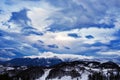 Mountain landscape in winter with cloudy sky Royalty Free Stock Photo