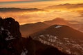 Mountain landscape with winter fog at sunse of Ceahlau, Romaniat Royalty Free Stock Photo