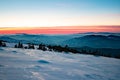 Mountain landscape with winter fog at sunse of Ceahlau, Romaniat Royalty Free Stock Photo