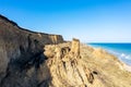 Mountain landslide in an environmentally hazardous area. Large crack in ground, descent of large layers of dirt. Deadly danger at