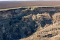 Mountain landslide in an environmentally hazardous area. Large crack in ground, descent of large layers of dirt. Deadly danger at