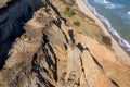 Mountain landslide in an environmentally hazardous area. Large crack in ground, descent of large layers of dirt. Deadly danger at