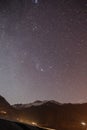 Mountain with little snow on the top in the purple and dark color night with stars in winter at Lachung in North Sikkim, India