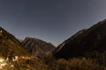 Mountain with little snow on the top with village in the night at Lachen in North Sikkim, India Royalty Free Stock Photo