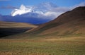 Mountain Looming over Tibetan Plateau Royalty Free Stock Photo