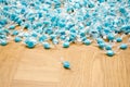 Mountain of many blue candies and one in front Royalty Free Stock Photo