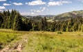 Mountain meadow with hills on the background in Kysucke Beskydy mountains Royalty Free Stock Photo