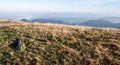 Mountain meadow with hills on the background Royalty Free Stock Photo