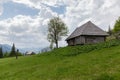 Mountain meadow with wooden herdsman huts in the Carpathian Mountains Royalty Free Stock Photo