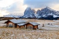 Mountain meadow and wooden house Alpe di Siusi or Seiser Alm the Langkofel mountain range with Bolzano province, South Tyrol in Royalty Free Stock Photo