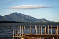 Mountain of Mestre Alvaro with cloud in the shape of an umbrella, wooden pier in the foreground