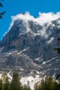 Mountain Mittelhorn: rocks, snow and clouds in Switzerland