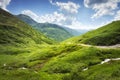 Mountain nature landscape in Svaneti, Georgia. Amazing view on grassy hills on sunny bright day. Wonderful highlands.