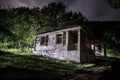 Mountain night landscape of building at forest at night with moon or vintage country house at night with clouds and stars. Summer Royalty Free Stock Photo