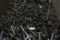 Mountain of nuts bolts screws washers in a box Royalty Free Stock Photo