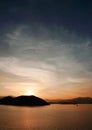 Mountain, ocean, cloud and the gradient sky at sunset Royalty Free Stock Photo