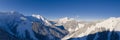 mountain panorama from Bichlbach to the mountain village Berwang in deep snow-covered winter with blue sky