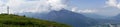 Mountain panorama with a gorgeous view of the Swiss Alps and Valleys and a summit cross Royalty Free Stock Photo