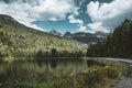 Mountain panorama with reflection flowers blue sky and clouds, British Columbia, Canada Royalty Free Stock Photo