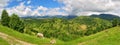 Mountain Panorama Rucar-Bran Pass, view to Piatra Craiului, cows feeding with grass - Carpathian mountains Royalty Free Stock Photo