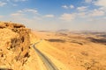 Mountain panorama and street in crater Makhtesh Ramon, Negev Desert, Israel Royalty Free Stock Photo