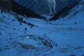 Mountain pass at night. Tourist with a flashlight looking for the trail in the mountains. Caucasian Mountains. Russia