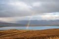 Mountain pass towards Akureyri in Iceland rainbow forming over fjord Royalty Free Stock Photo