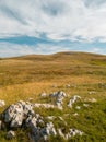 Mountain pastures with lots of big rocks Royalty Free Stock Photo