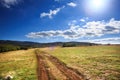 Mountain path leads through plain with beautiful scenic mountain