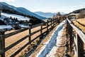 Mountain path and long wooden fence in Dolomite Alps Royalty Free Stock Photo