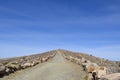 Mountain path, trail at a sunny day with blue sky, Titicaca Lake, Bolivia Royalty Free Stock Photo