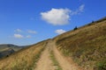 Mountain pathway under clouds Royalty Free Stock Photo