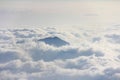 Mountain peak above sea of clouds. Royalty Free Stock Photo