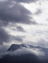 Mountain peak dominated by clouds